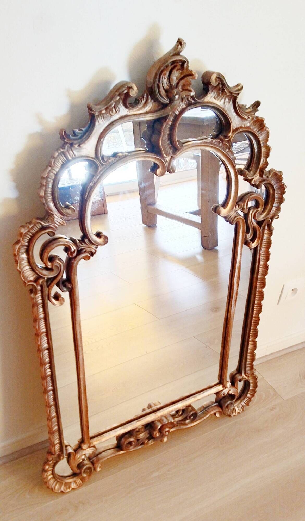 Antique mirror with rococo-style pareclose, in gilded wood, 19th century