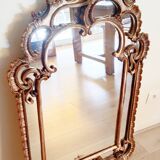 Antique mirror with rococo-style pareclose, in gilded wood, 19th century