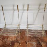 Folding chairs with gold metal structure and methacrylate slats seat and back.