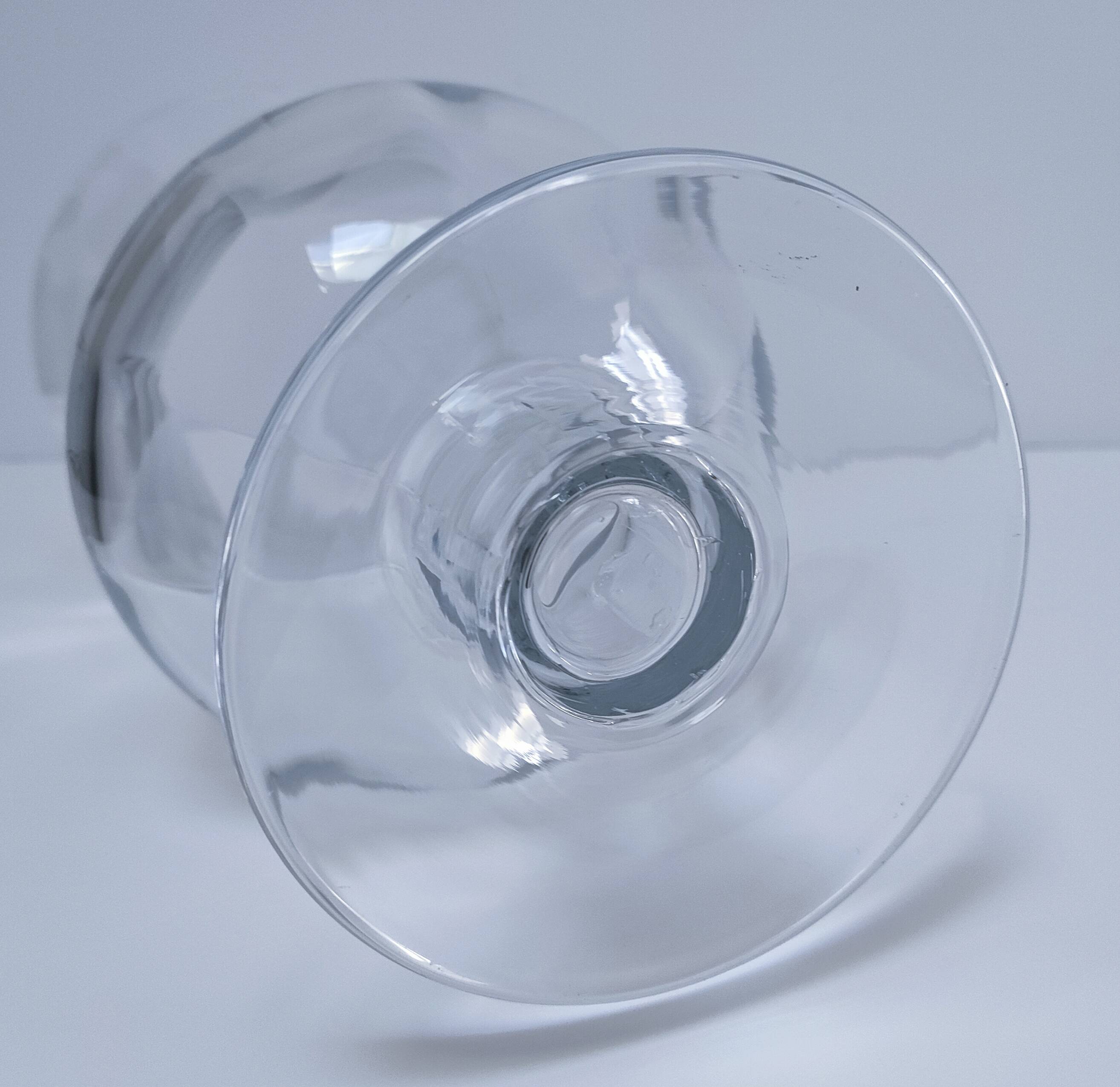 Pair of tall clear glass candlesticks from the early 20th century