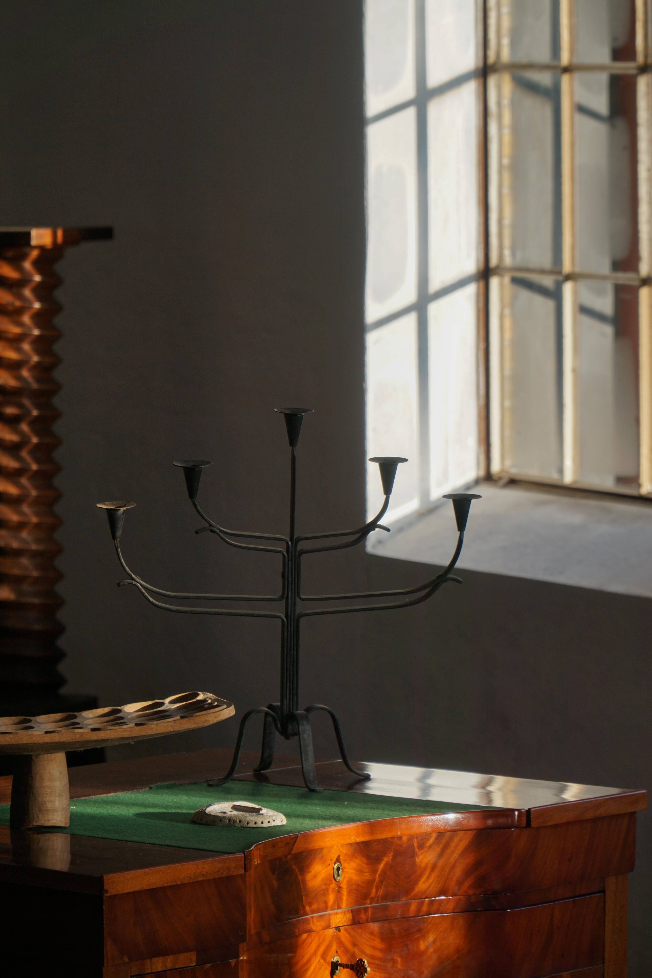 Brutalist Scandinavian candlestick in wrought iron and metal from the mid-20th century.