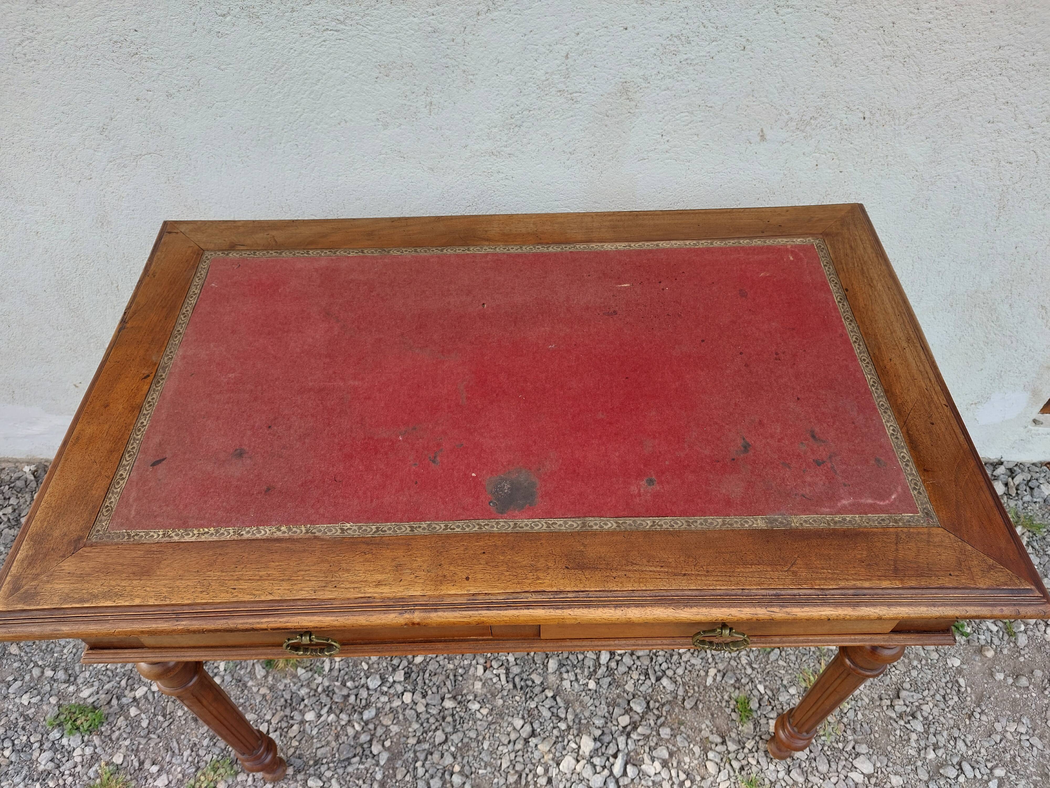 Old wooden desk, red felt top