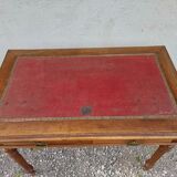 Old wooden desk, red felt top