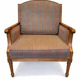 Armchair in the style of Louis XVI made of solid wood, striped fabric.
