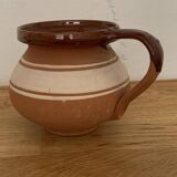 Hungarian folk ceramic pitcher in glossy brown and beige, traditional rounded pot.