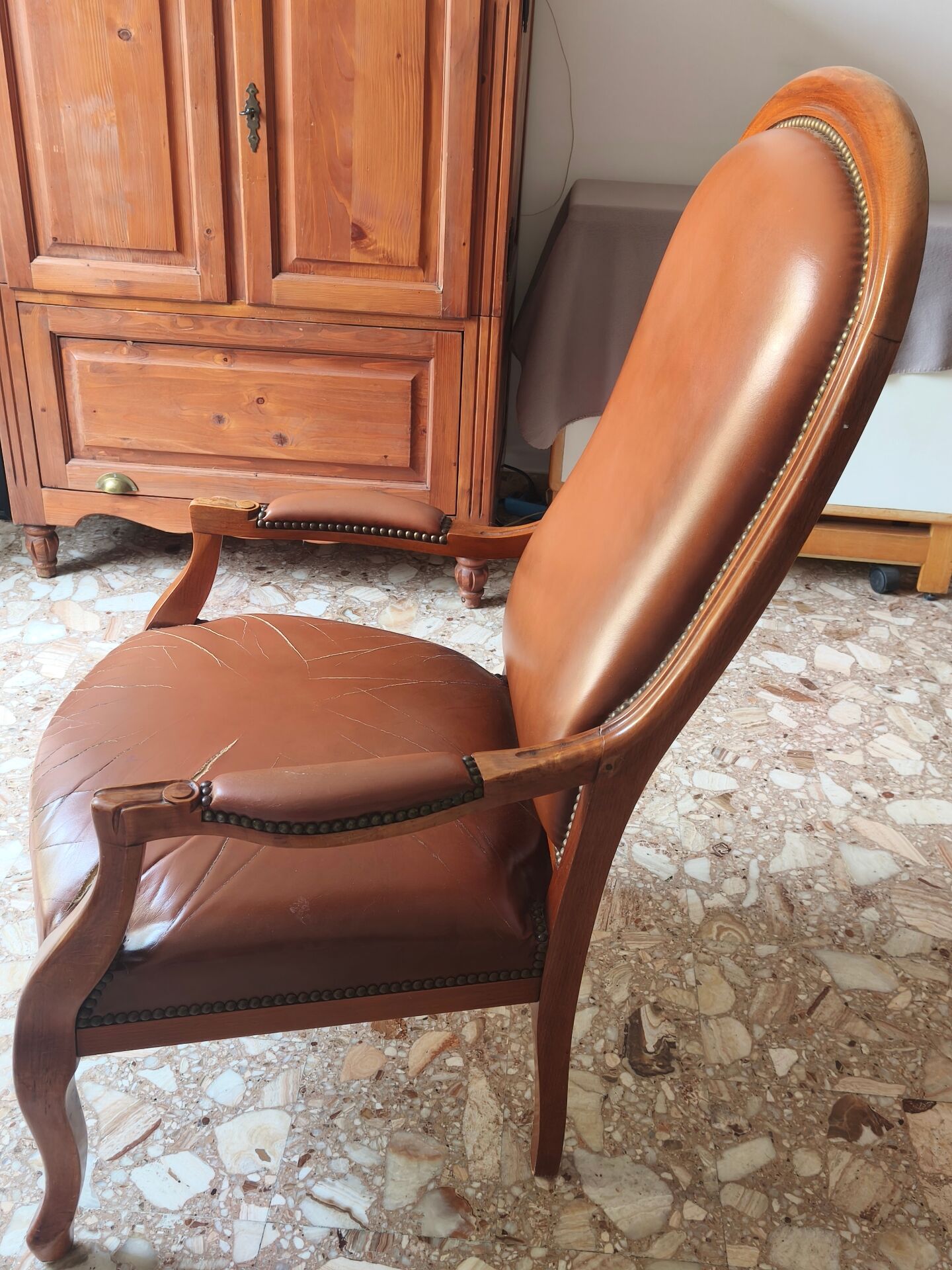Leather armchair signed