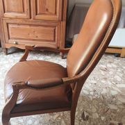 Leather armchair signed