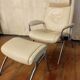 Beige leather armchair and footstool