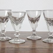 4 antique stemmed wine glasses with flat sides, made of blown glass from the 19th century