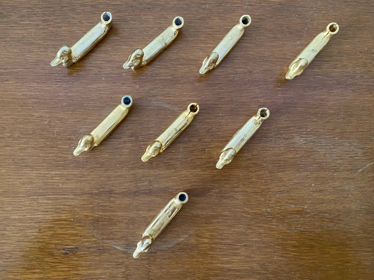 Set of 8 antique privilege knife holders gold metal duck vintage