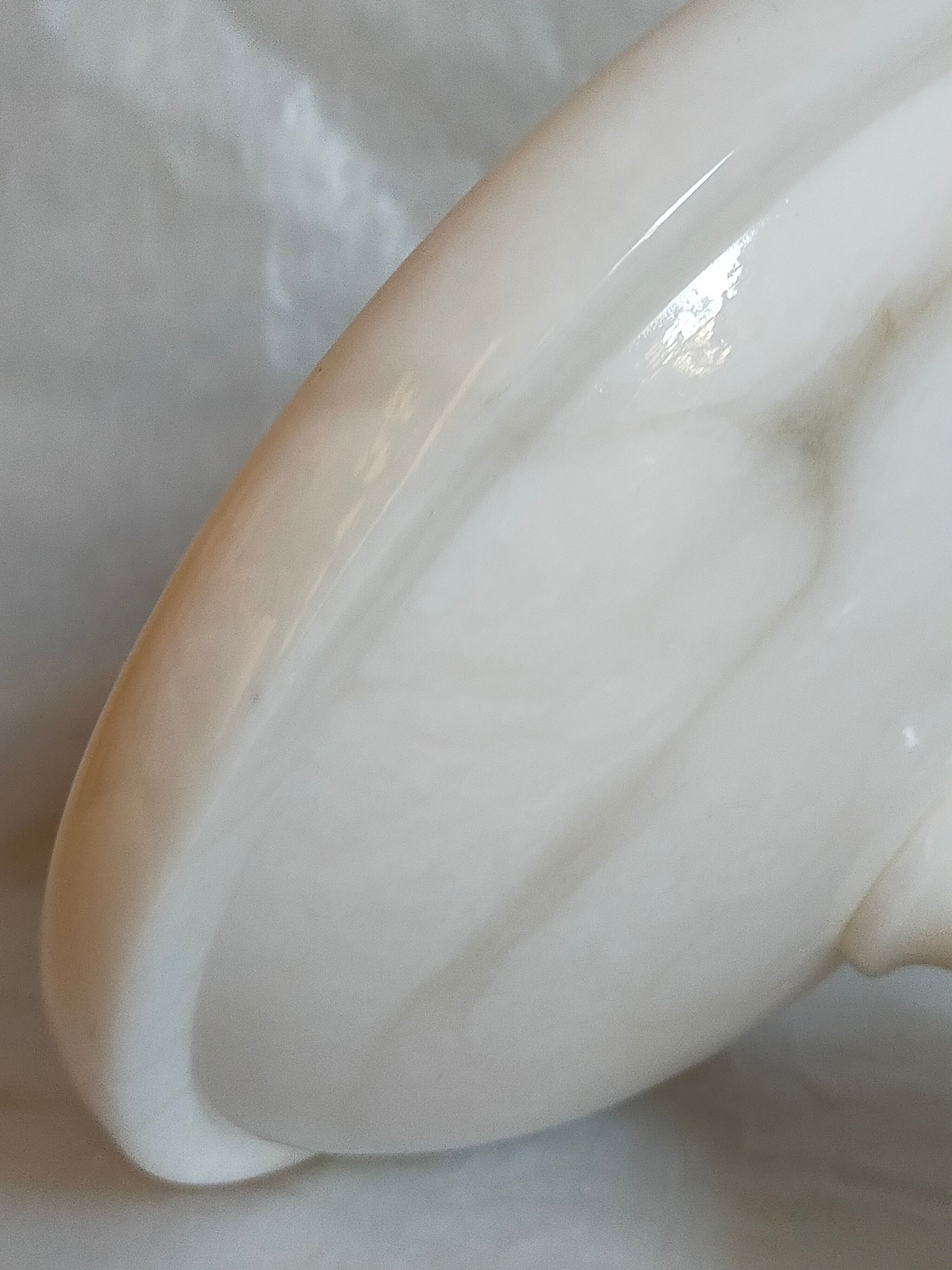 Standing cup in old white marble