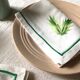 Series of four embroidered linen napkins