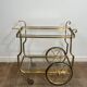Rolling Table with Large Brass and Glass Wheels, Maison Jansen, Circa 1940