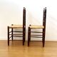 Pair of antique rush-seated chairs in solid wood – France, mid-20th century