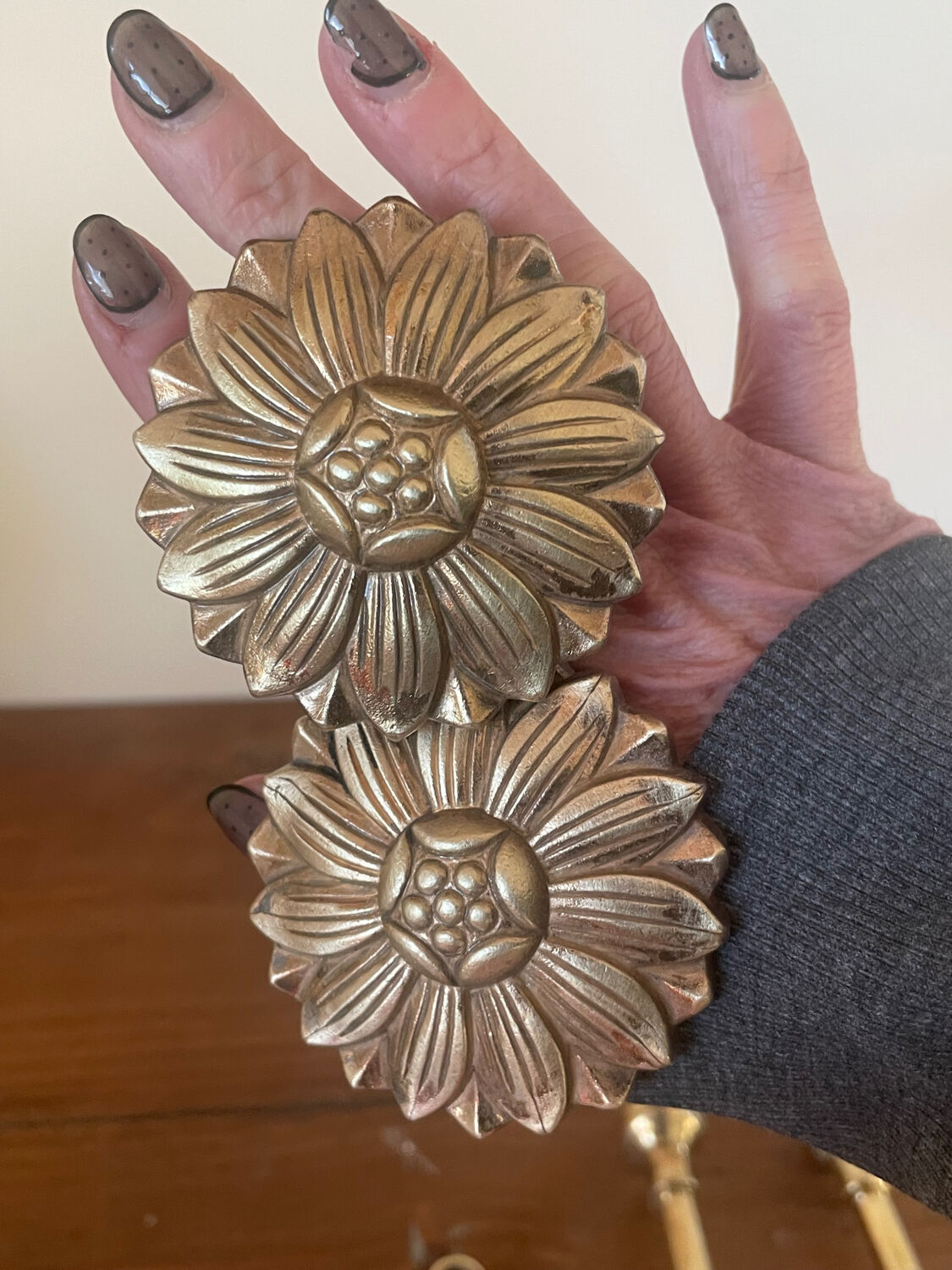 2 golden brass hooks with flower curtain tiebacks