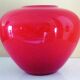 Pot-bellied, art deco vase in speckled ruby red multi-layered glass, white interior