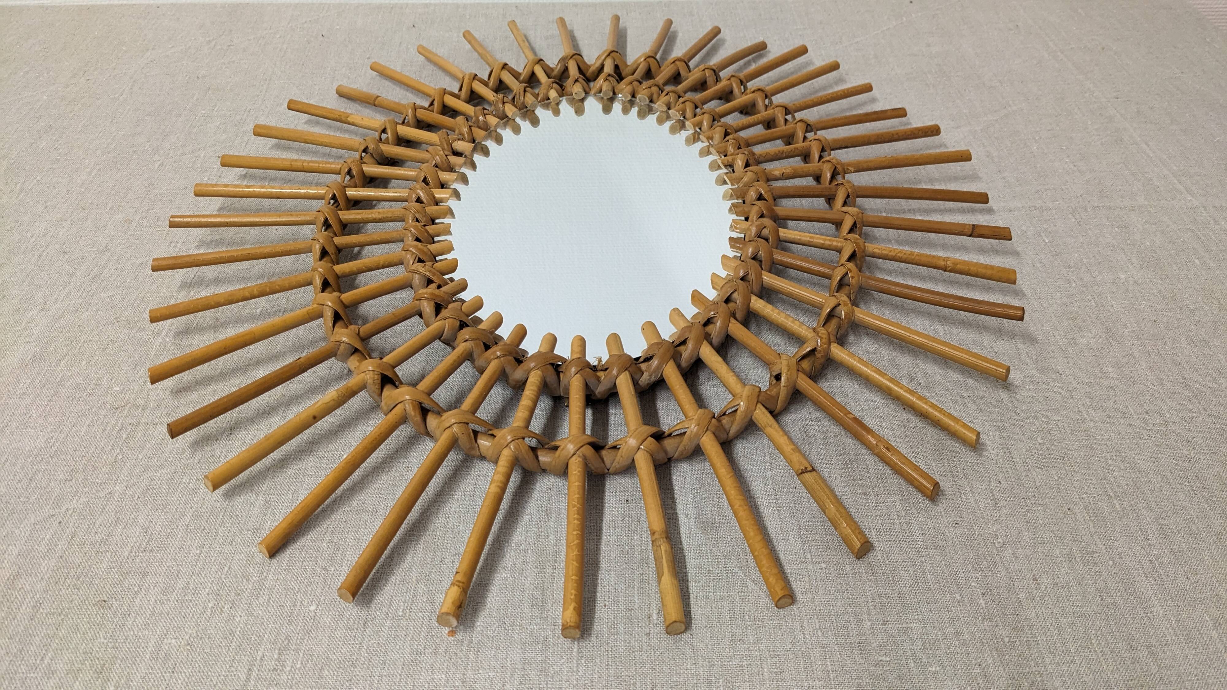 Oval rattan mirror, France circa 1960.