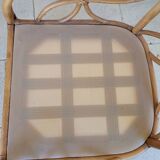 Two large rattan armchairs
