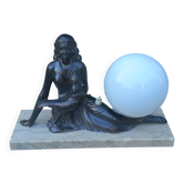 Art Deco lamp in cast iron and marble with a white opaline globe.