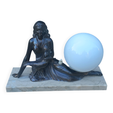 Art Deco lamp in cast iron and marble with a white opaline globe.