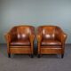 Set de 2 fauteuils Art Déco en cuir de mouton passepoil noir