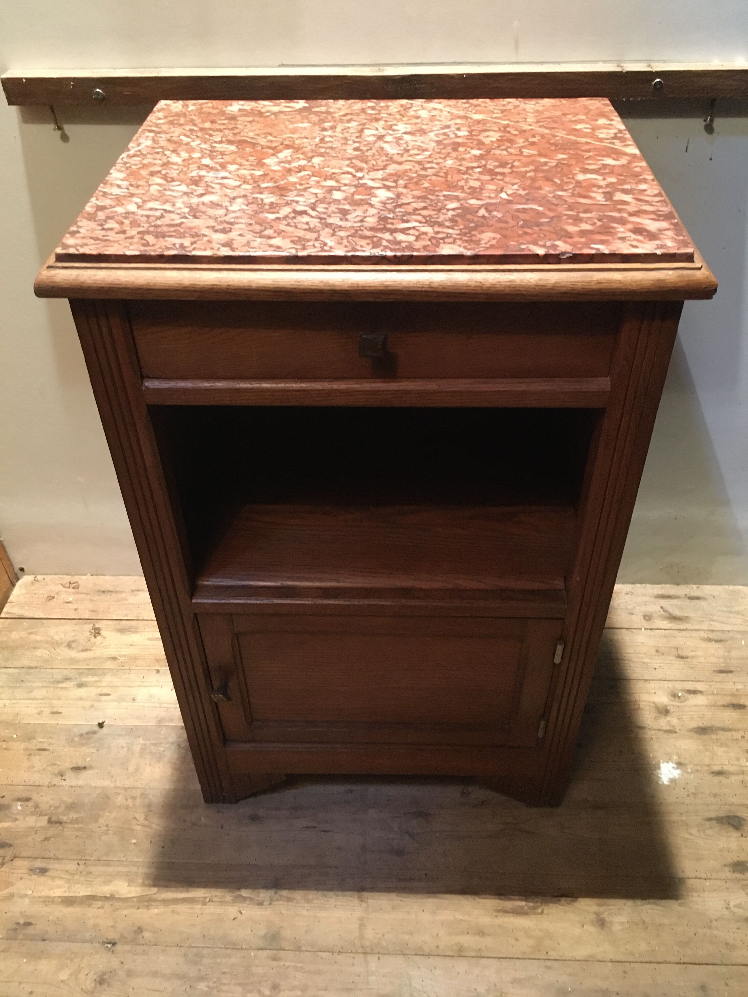 Solid oak bedside table with brown marble.