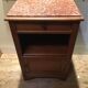 Solid oak bedside table with brown marble.
