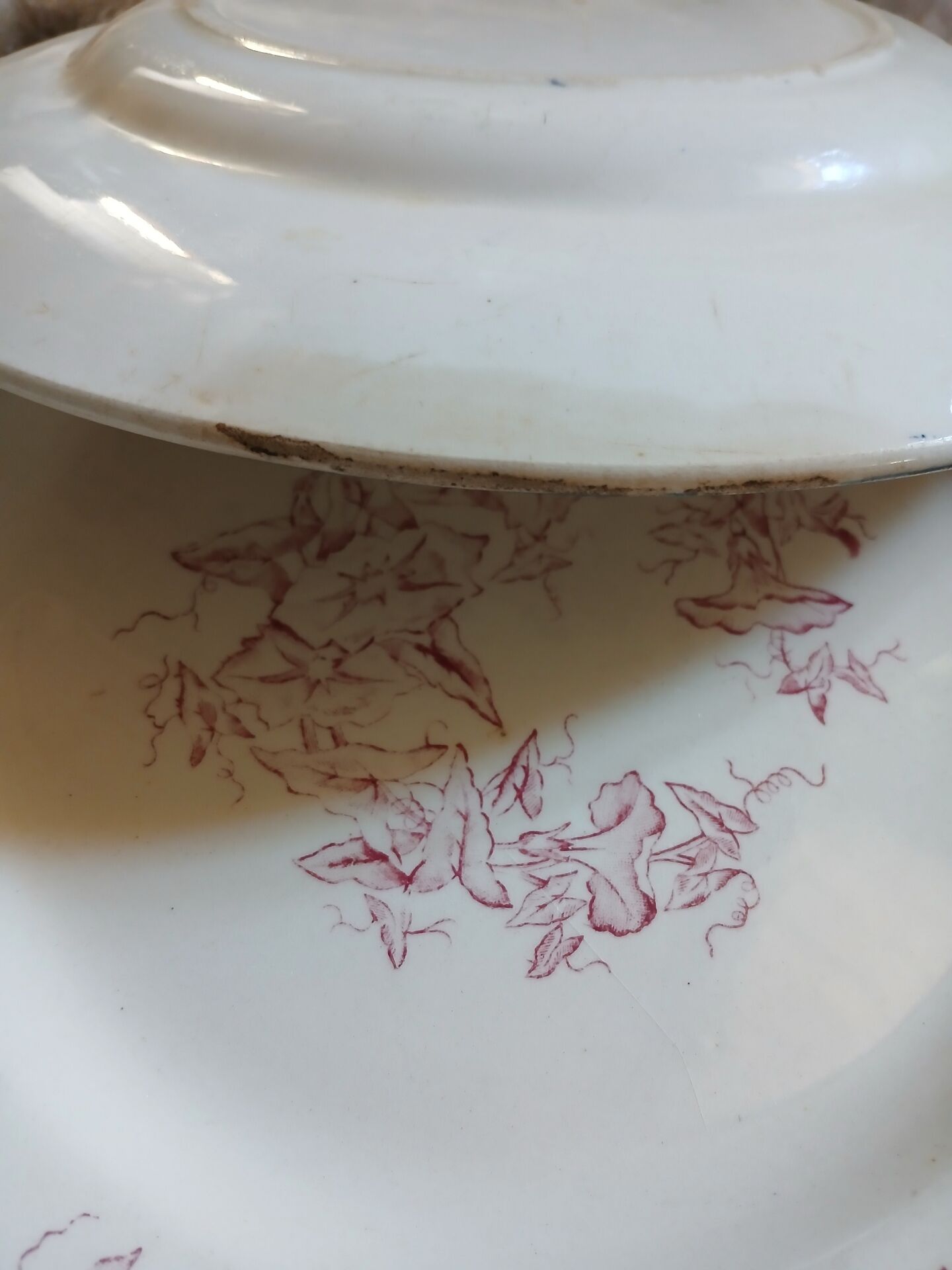 13 mismatched flat plates in ironstone