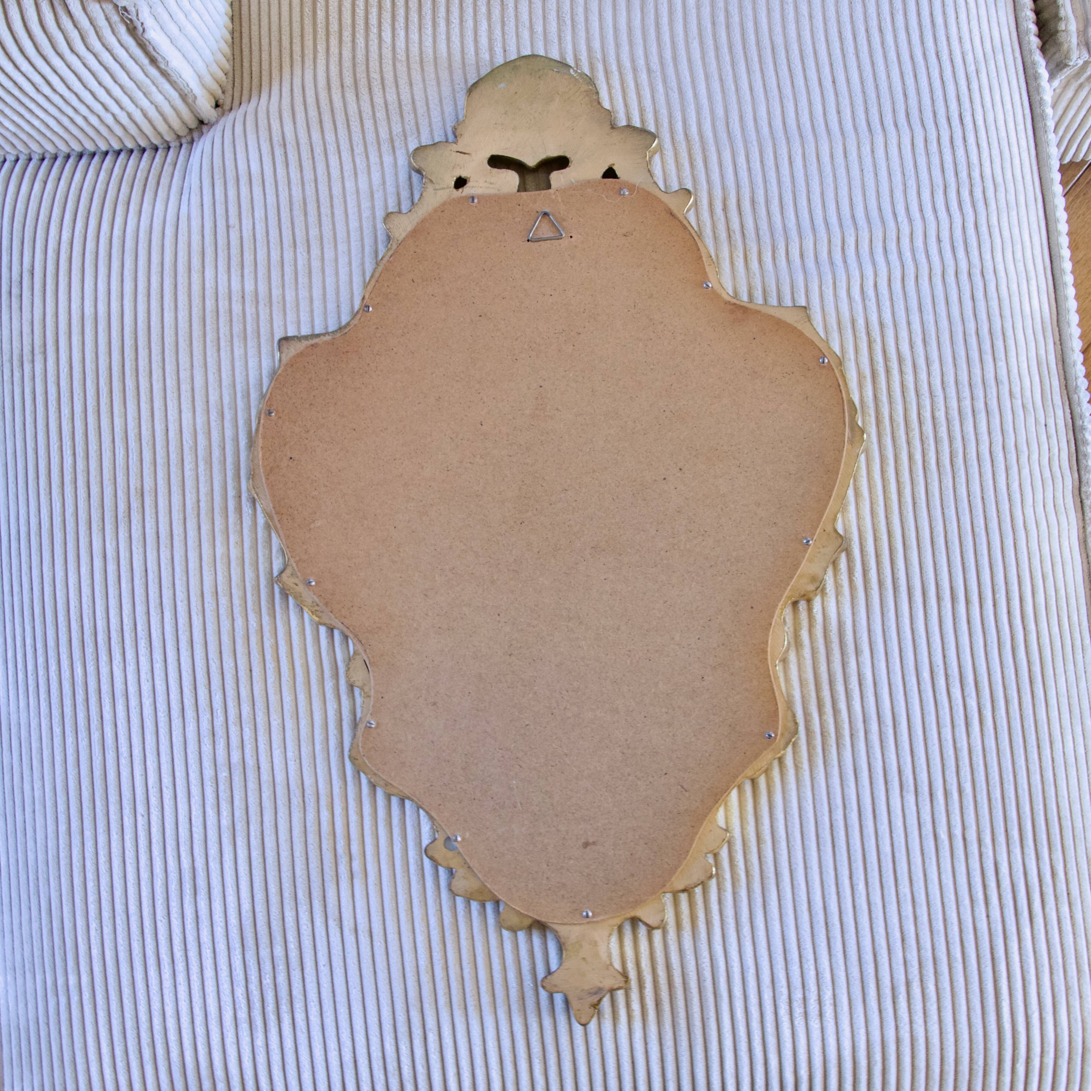 Antique Baroque mirror with gilded metal panels