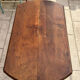 Farm table, two drop-leaves, 19th century, solid walnut.