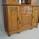 Art Nouveau oak buffet and dinanderie panels, circa 1910