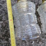 Duo of vintage molded glass globe pendant lights.