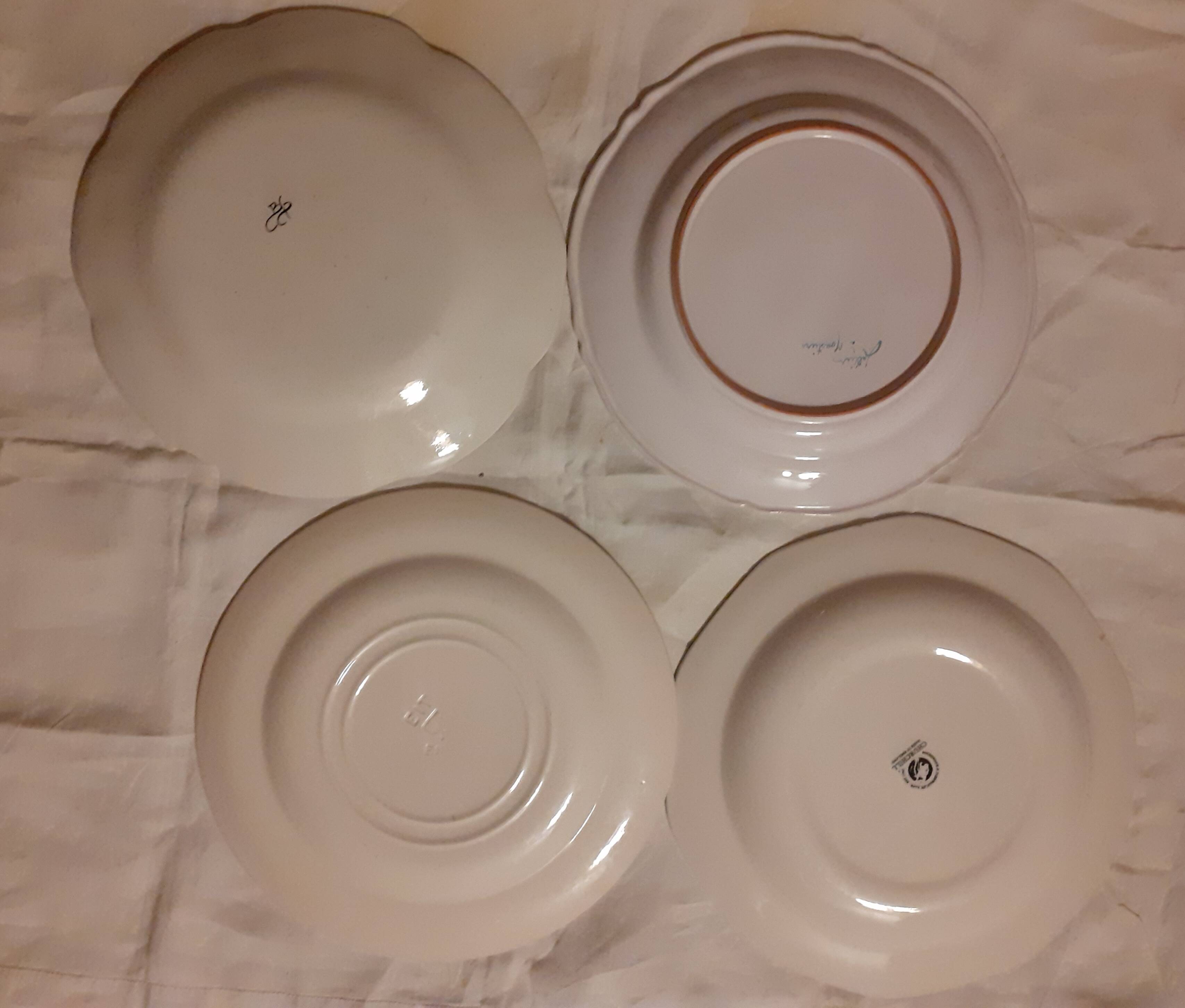Set of four retro fruit and flower flat plates from Moustiers...
