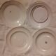 Set of four retro fruit and flower flat plates from Moustiers...