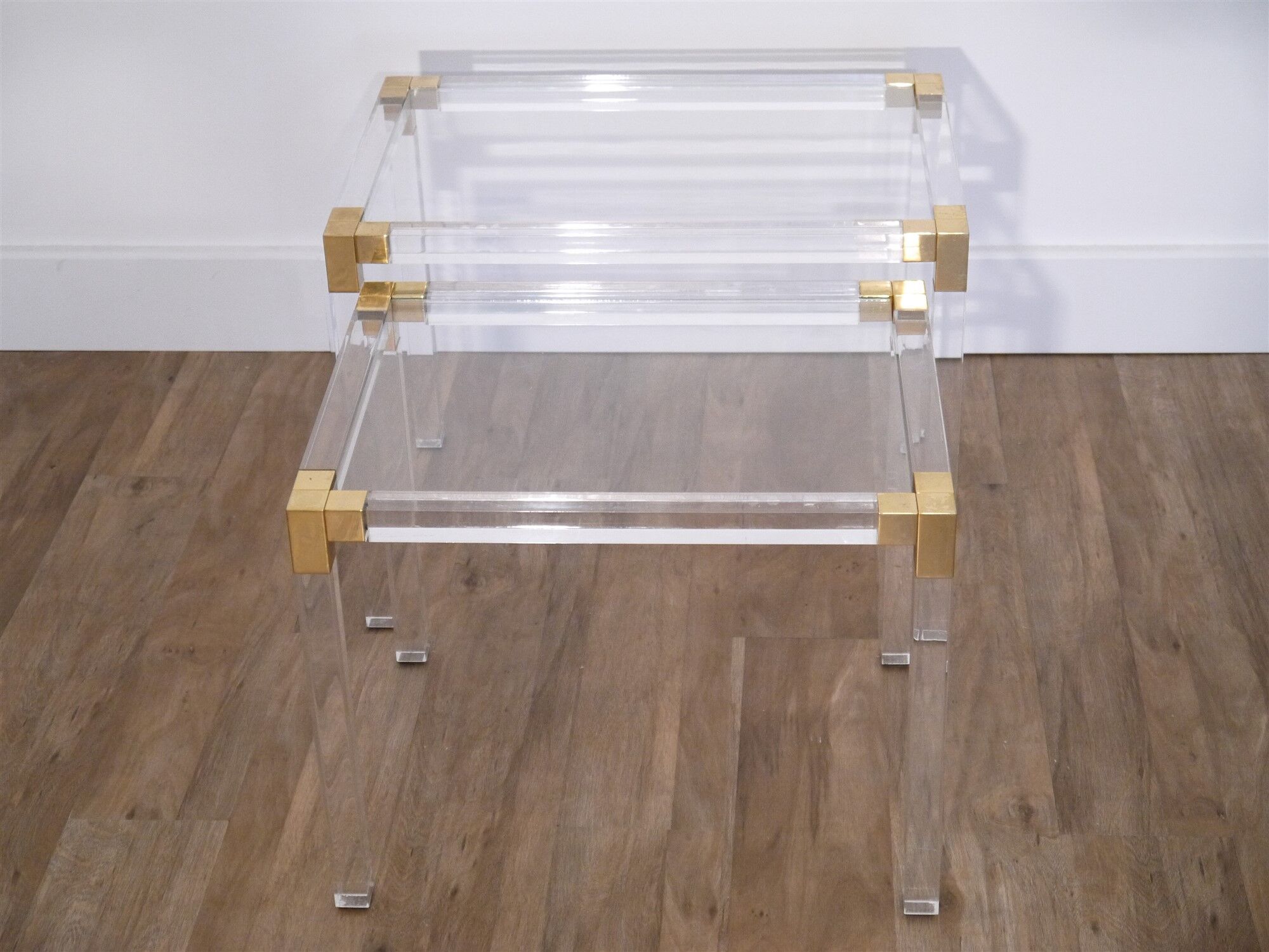 Nesting tables from the 1970s in brass, glass and lucite