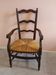Wooden armchair with a straw seat