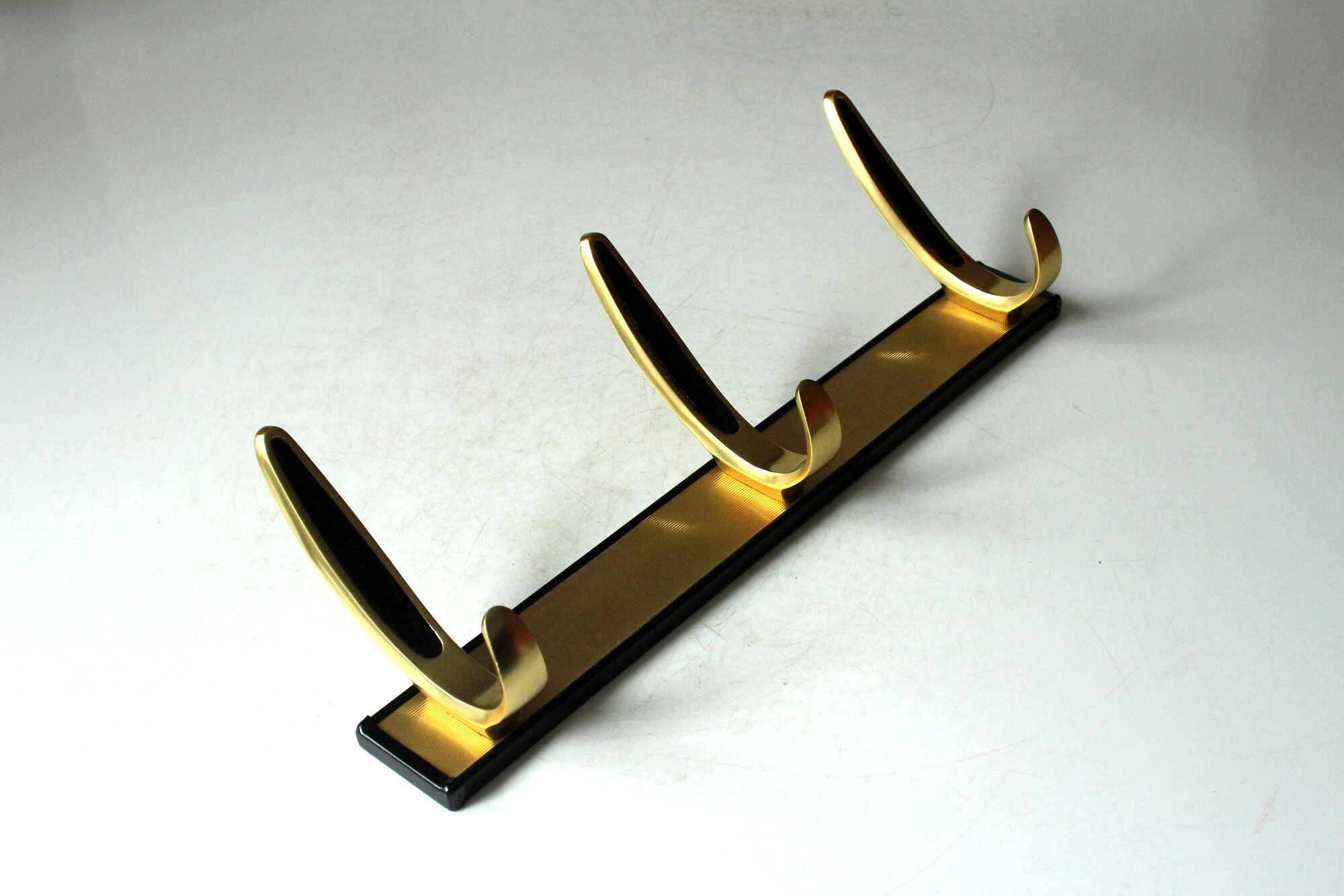 Rockabilly wall mounted metal  and brass coat rack with 3 hooks, vintage from the 1950s