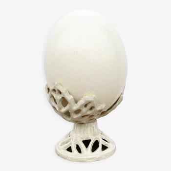 Ostrich egg on pedestal