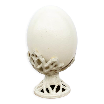 Ostrich egg on pedestal