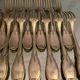 12 forks and 12 spoons in Louis XVI style metal