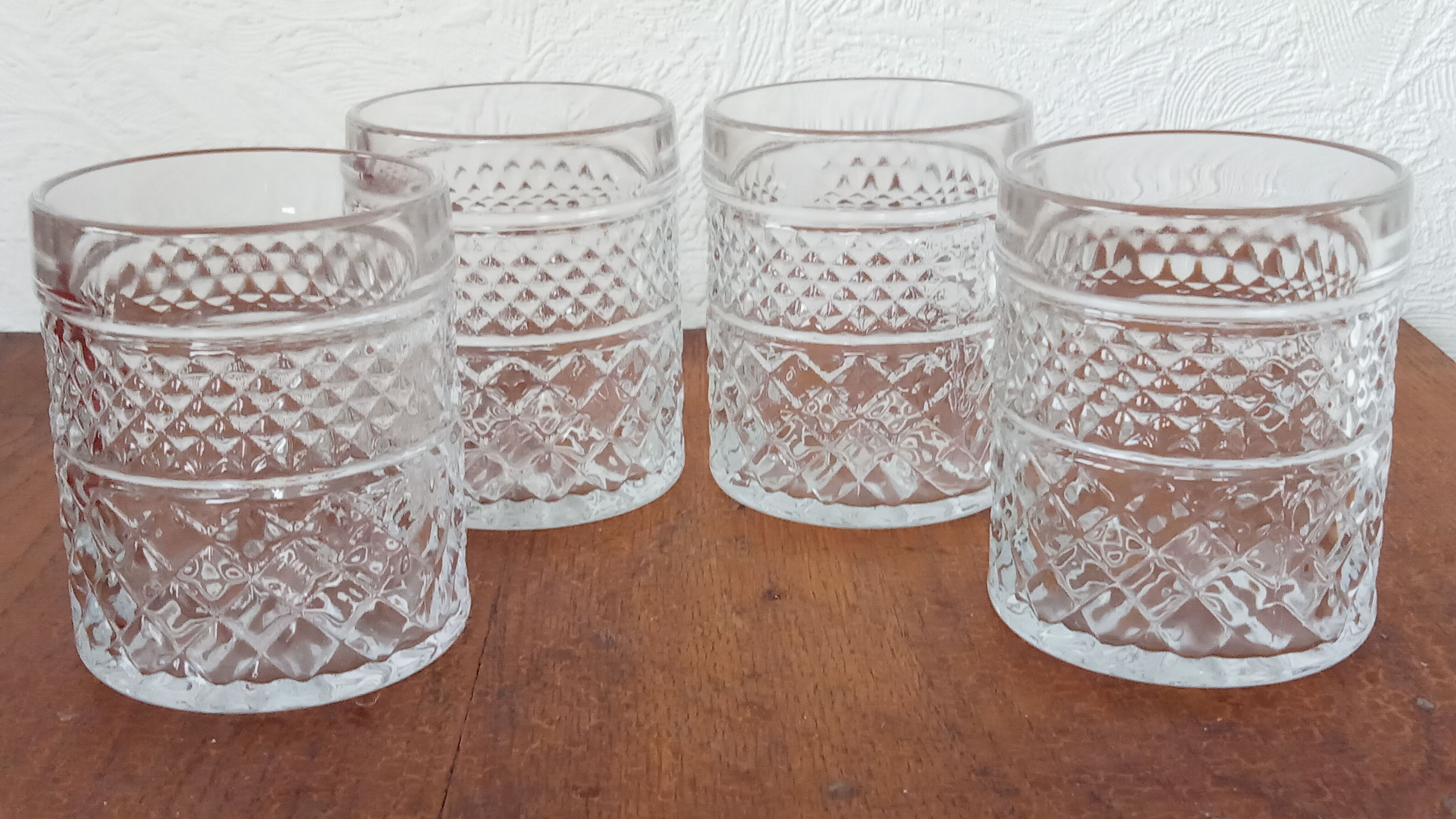 Four whiskey glasses