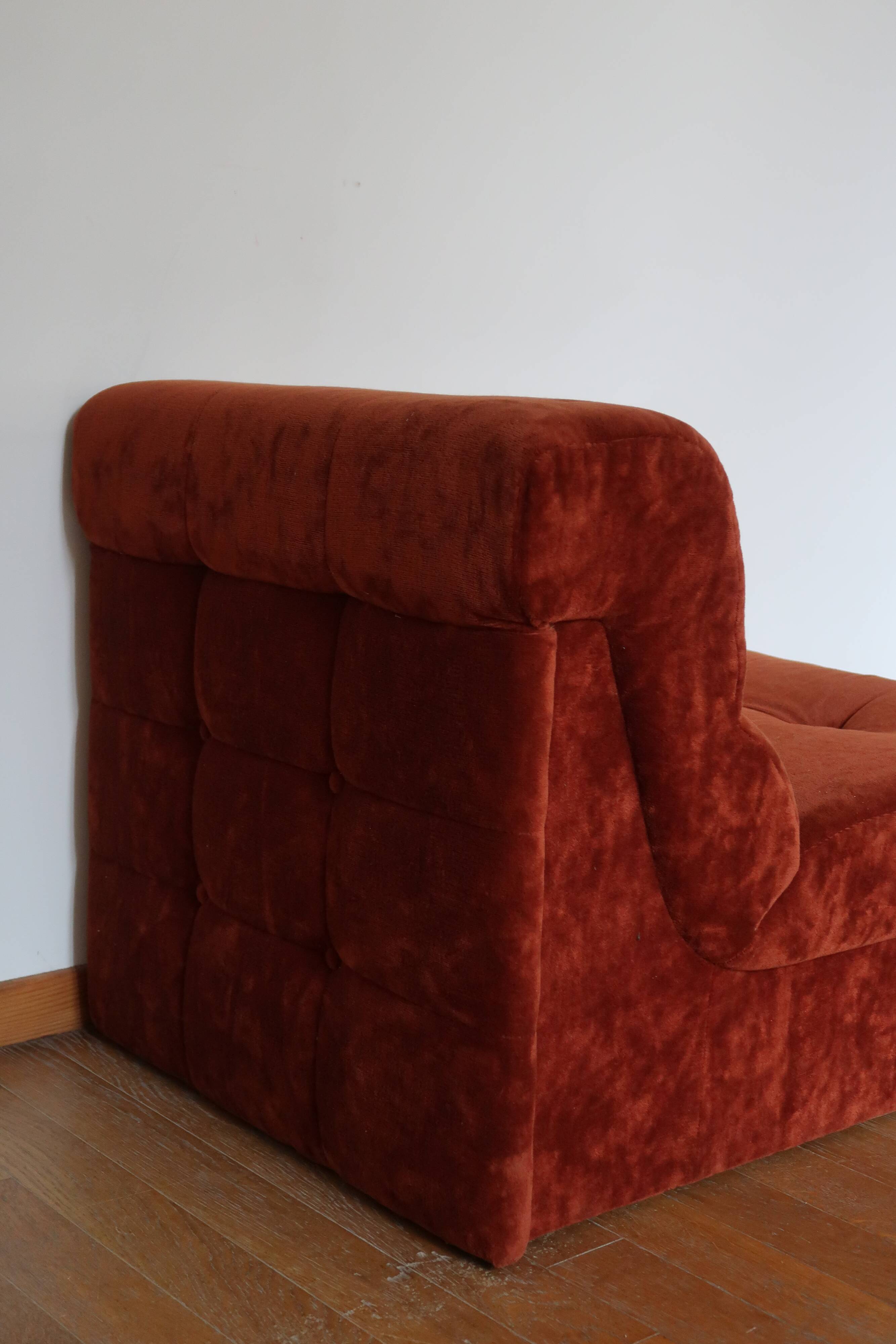 Rusty velvet low chair without arms