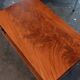 Coffee table / side table in mahogany with a rattan shelf.