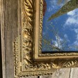 Miroir en bois et stuc doré