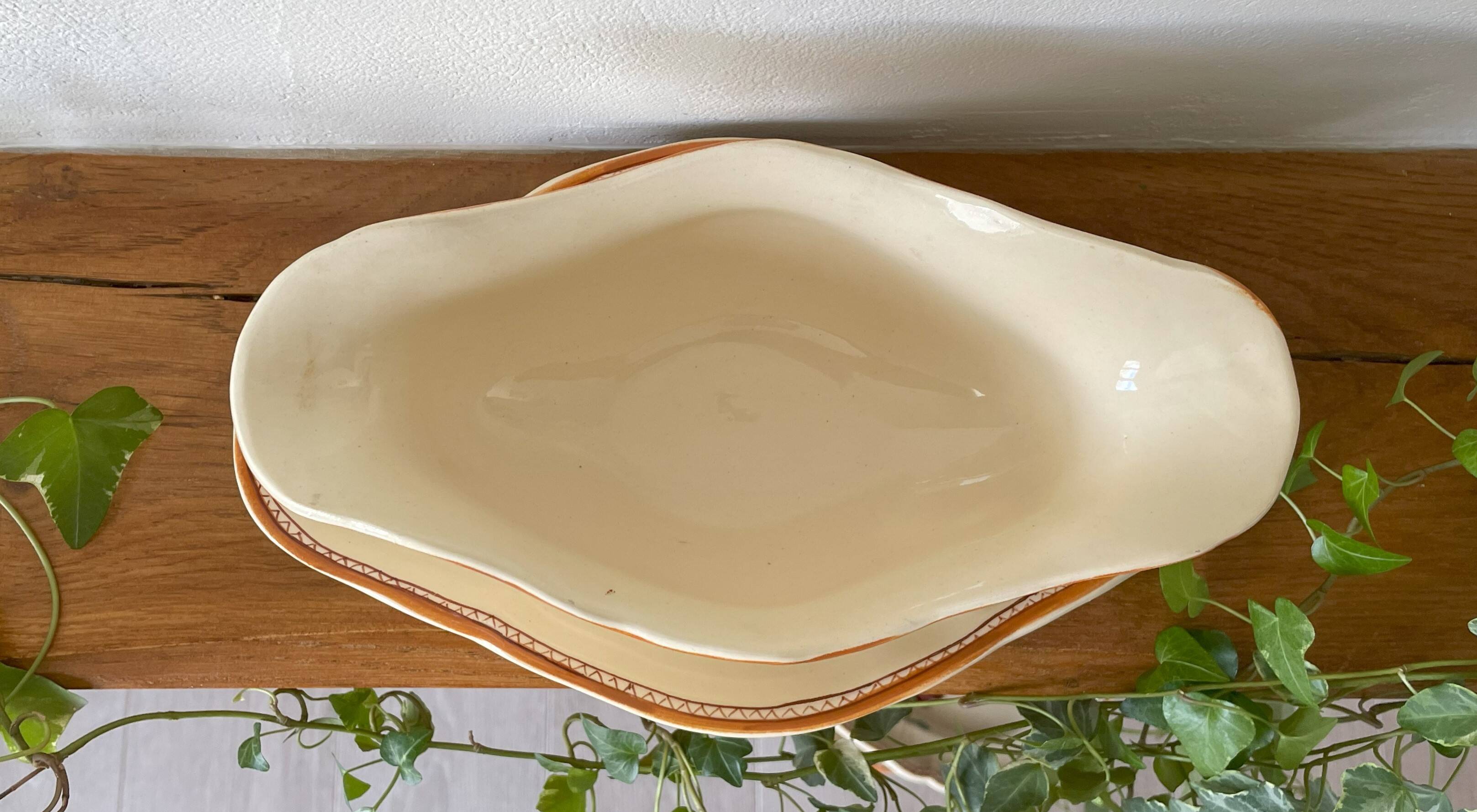 Large antique sauceboat in Longchamp earthenware.