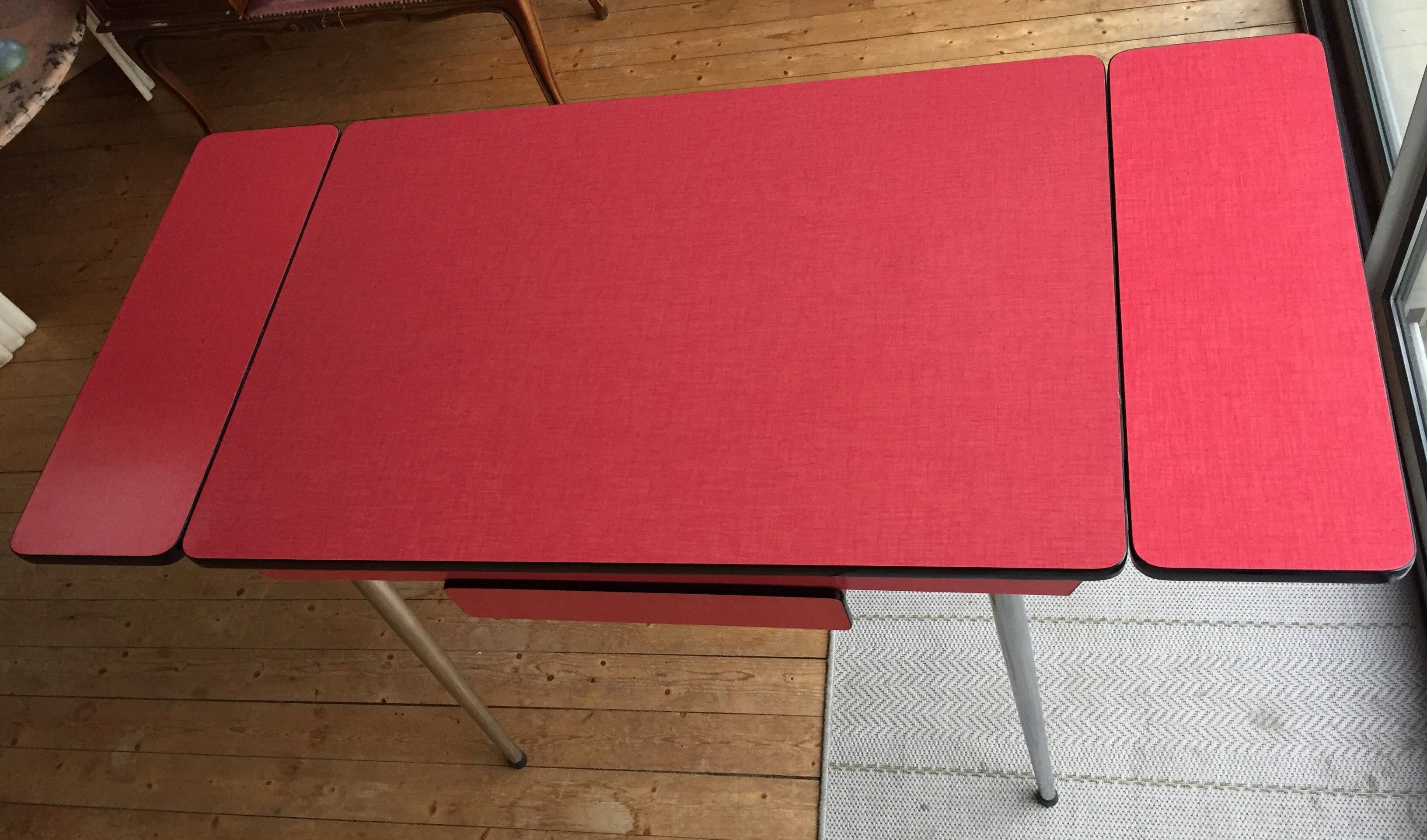 Table set and 2 vintage vintage pale red formica chairs