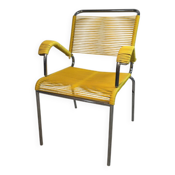 Yellow scoubidou armchair with a chrome tubular frame.
