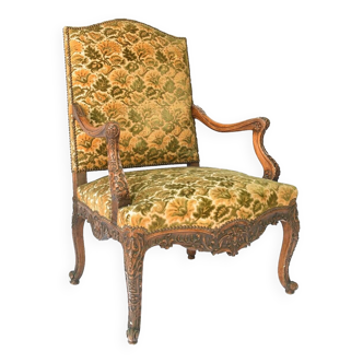Louis XV style armchair in richly carved wood