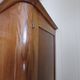 Vintage 1960s wooden wardrobe with a central mirror and tapered legs.