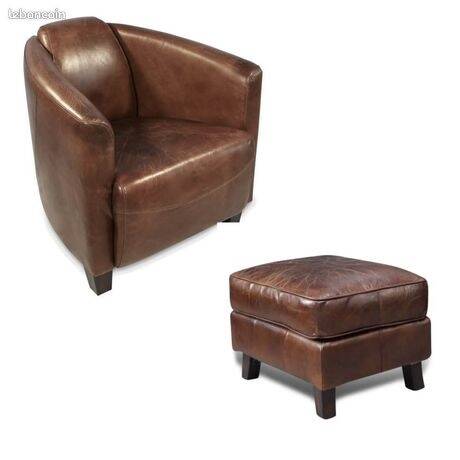 Brown leather club chair with its pouffe.
